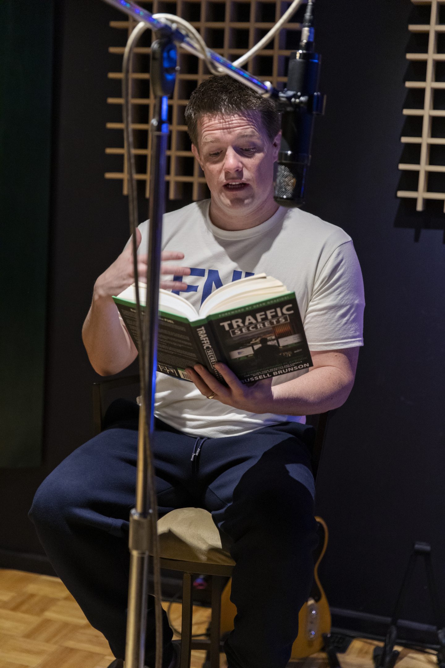Russell Brunson reading his Traffic Secrets Book